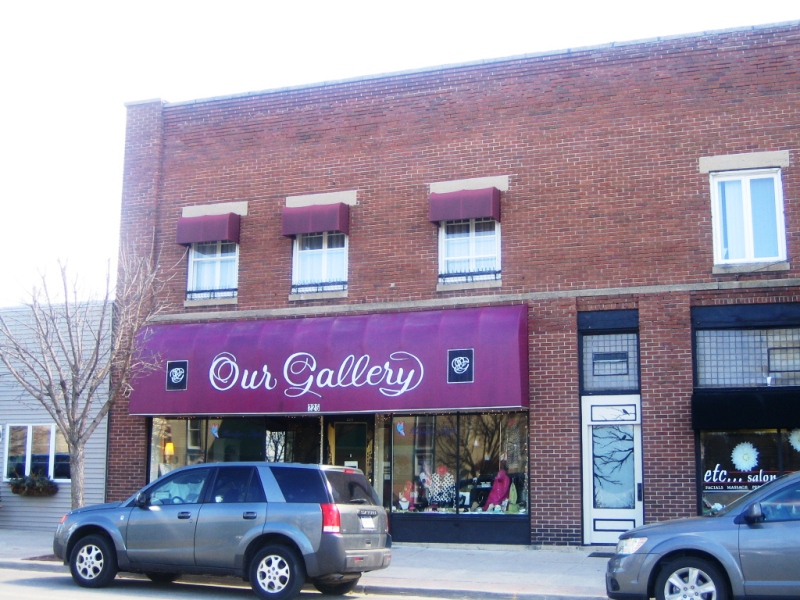 A building with a purple sign on it's side.